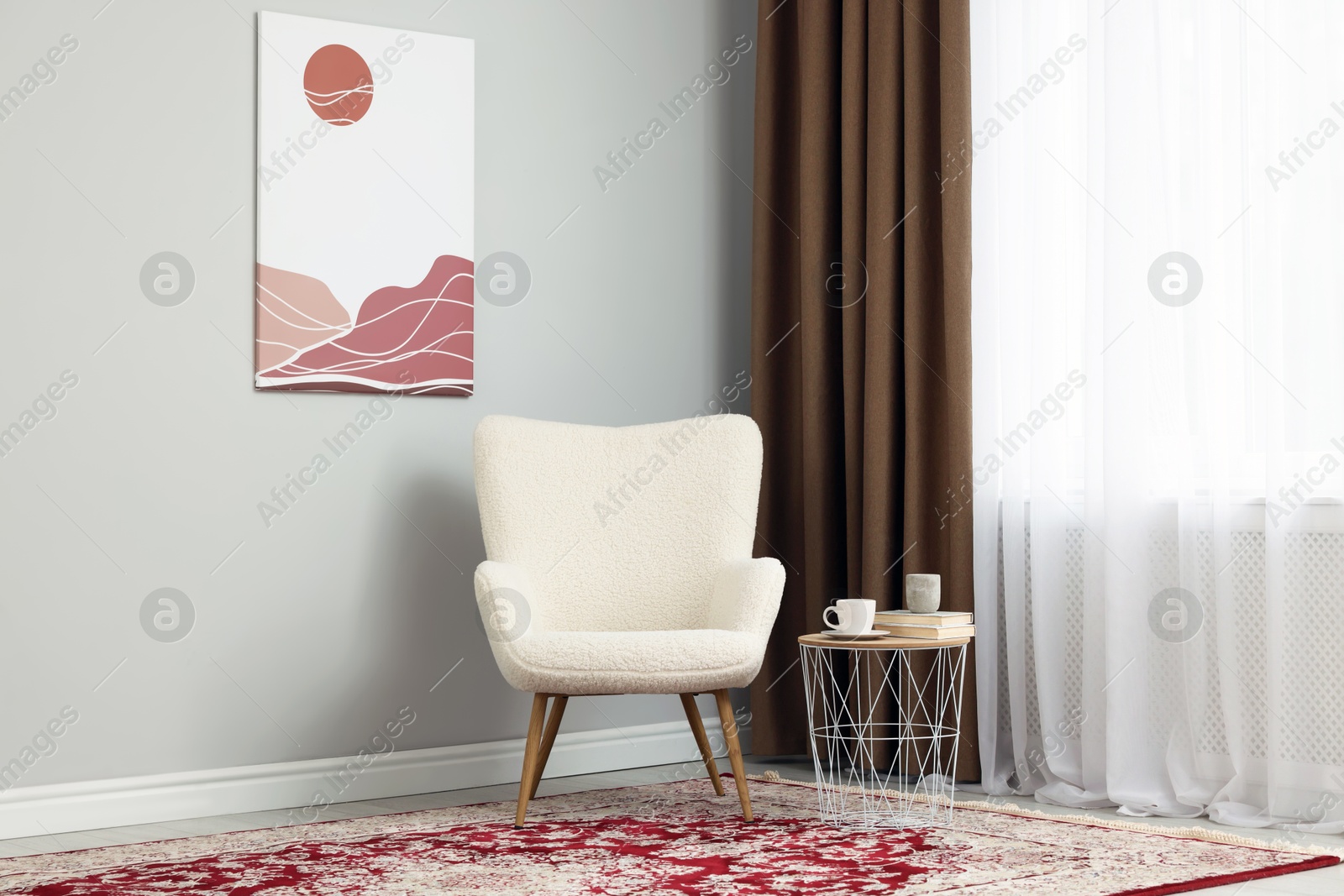 Photo of Soft armchair, side table and window with curtains indoors. Interior design