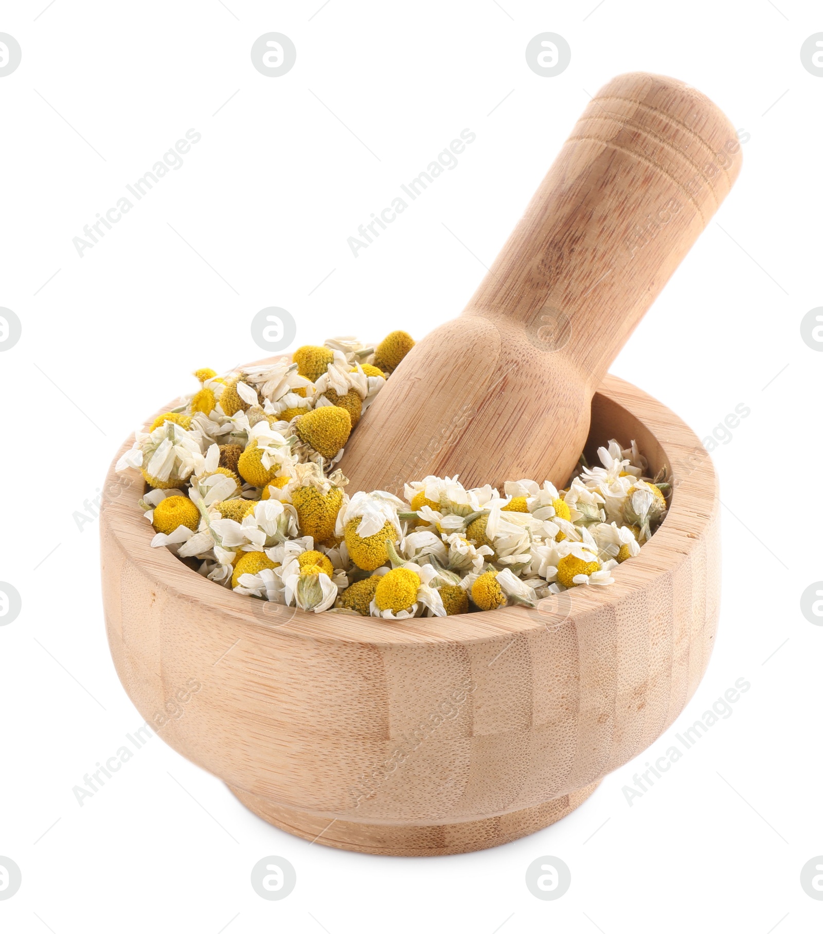 Photo of Mortar and pestle with chamomile flowers isolated on white