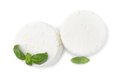 Fresh ricotta (cream cheese) and basil isolated on white, top view