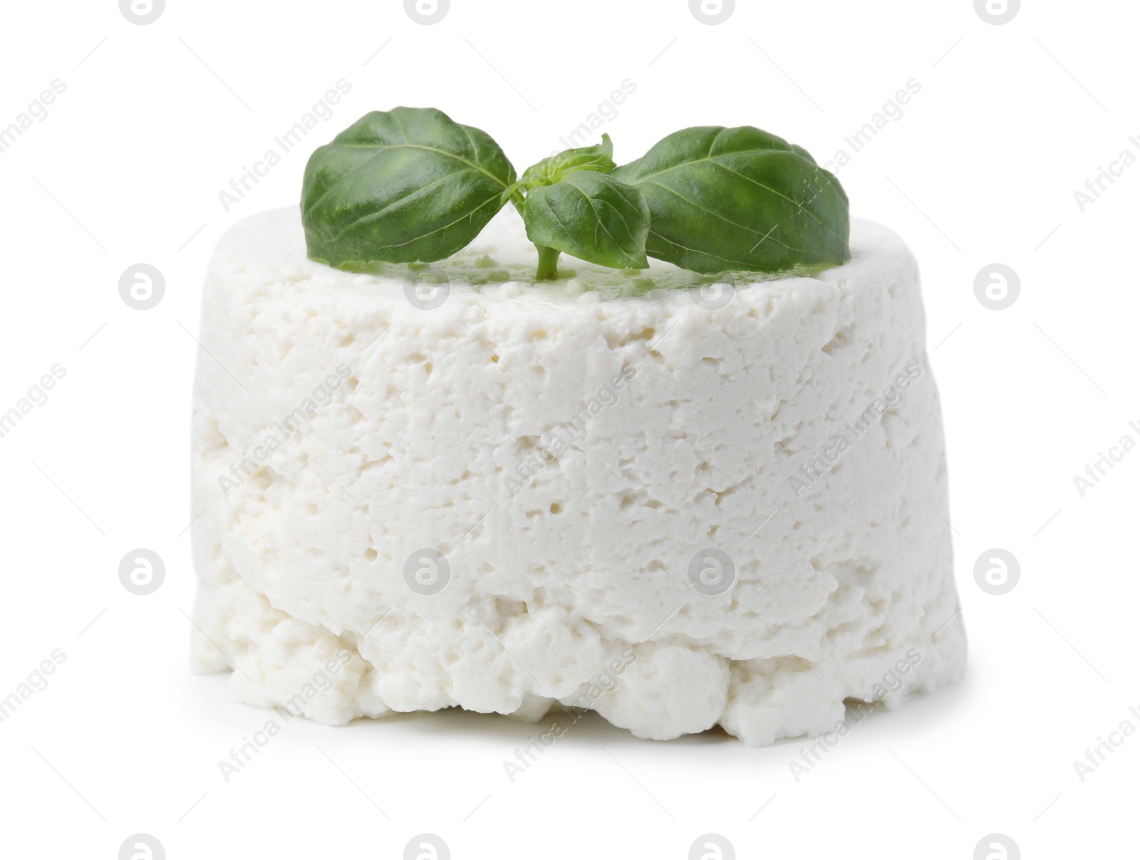 Photo of Fresh ricotta (cream cheese) and basil isolated on white