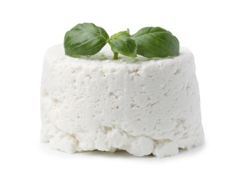 Fresh ricotta (cream cheese) and basil isolated on white