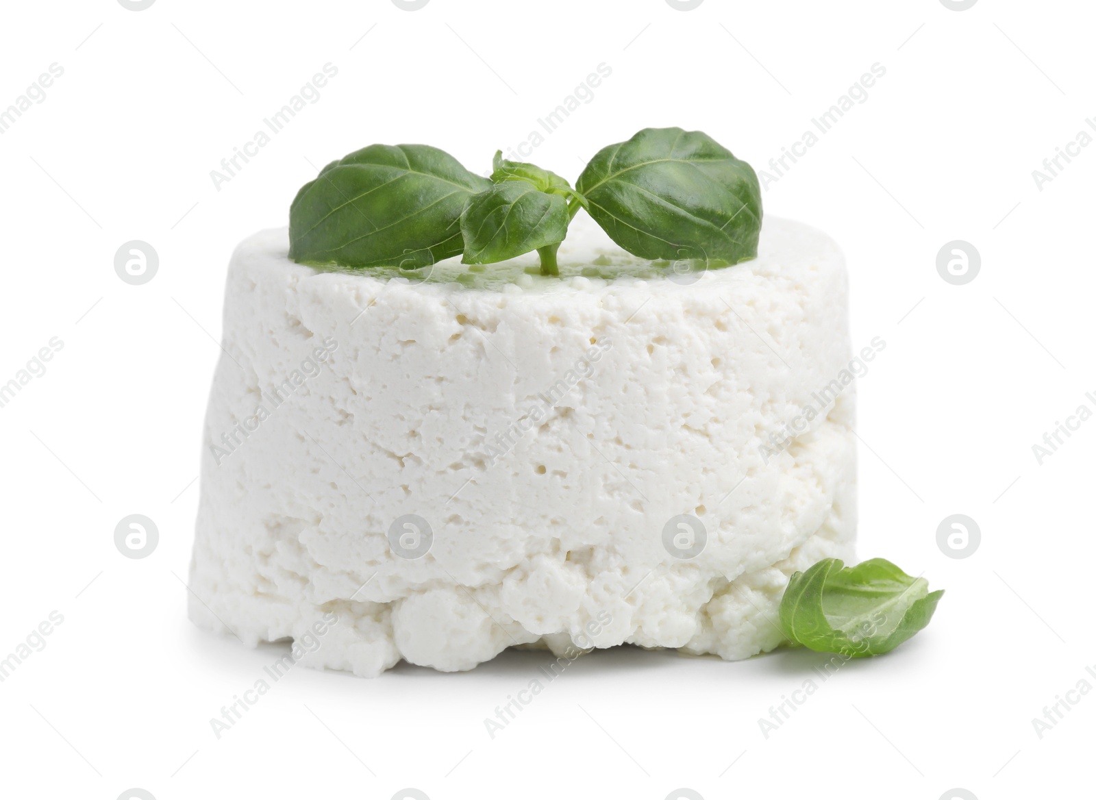 Photo of Fresh ricotta (cream cheese) and basil isolated on white