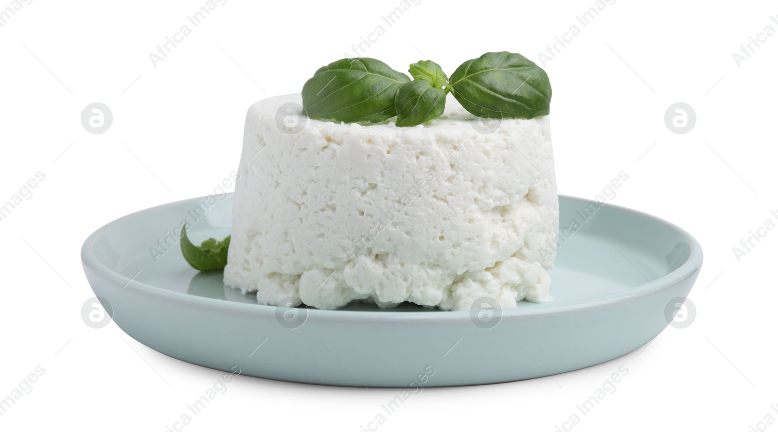 Photo of Fresh ricotta (cream cheese) and basil isolated on white