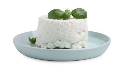 Photo of Fresh ricotta (cream cheese) and basil isolated on white