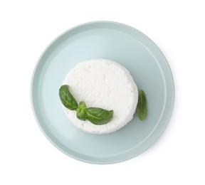 Photo of Fresh ricotta (cream cheese) and basil isolated on white, top view