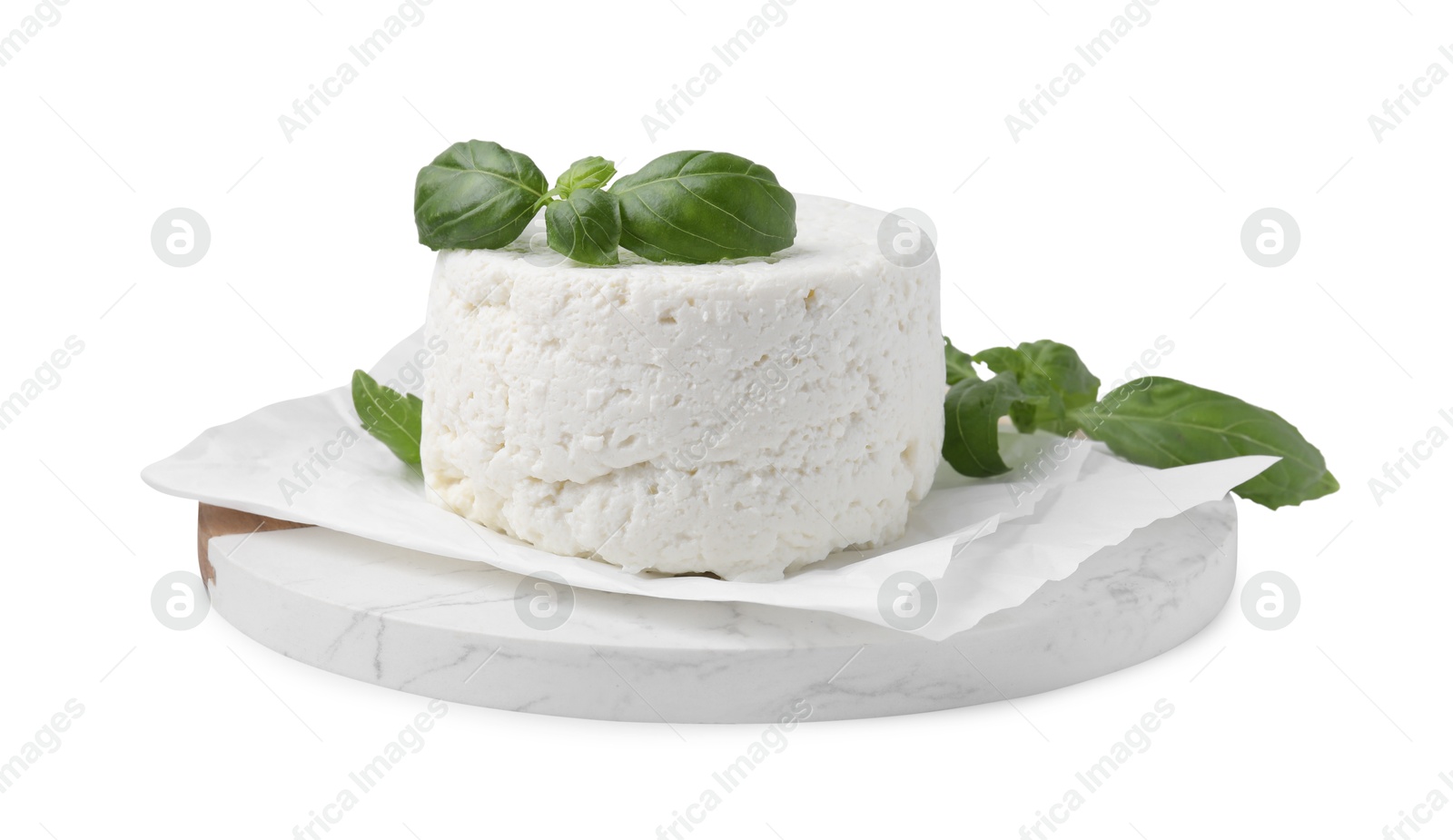 Photo of Fresh ricotta (cream cheese) and basil isolated on white