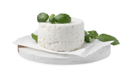 Photo of Fresh ricotta (cream cheese) and basil isolated on white