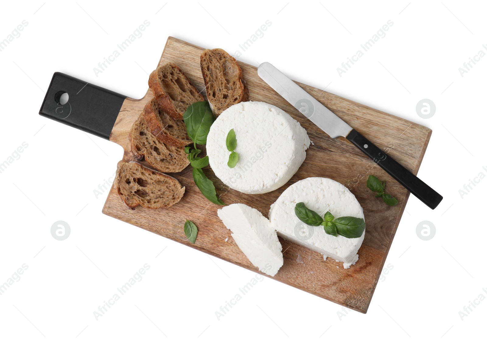 Photo of Fresh ricotta (cream cheese), basil, bread and knife isolated on white, top view