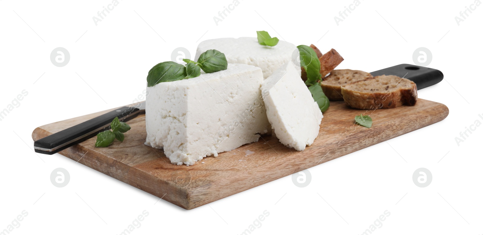 Photo of Fresh ricotta (cream cheese), basil, bread and knife isolated on white