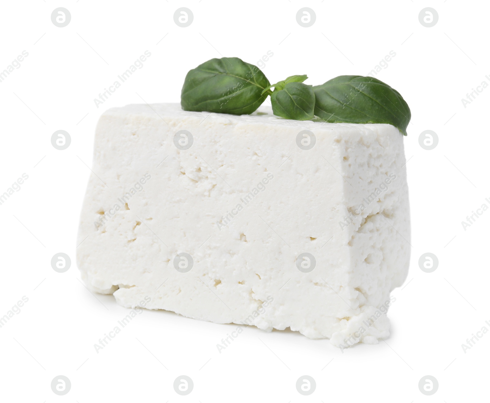 Photo of Fresh ricotta (cream cheese) and basil isolated on white