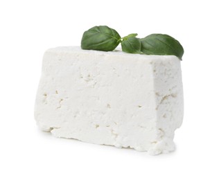 Photo of Fresh ricotta (cream cheese) and basil isolated on white