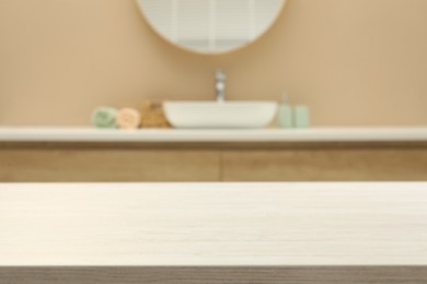 Empty wooden table in bathroom. Space for design