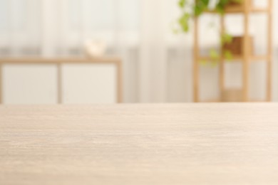 Empty wooden table in living room, selective focus