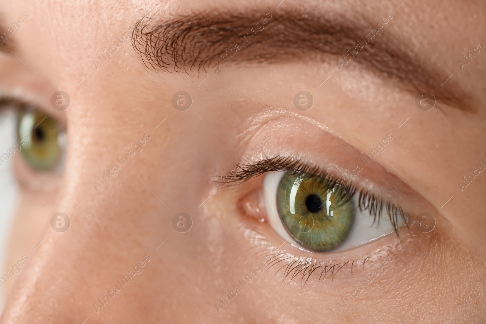 Photo of Closeup view of woman with beautiful green eyes