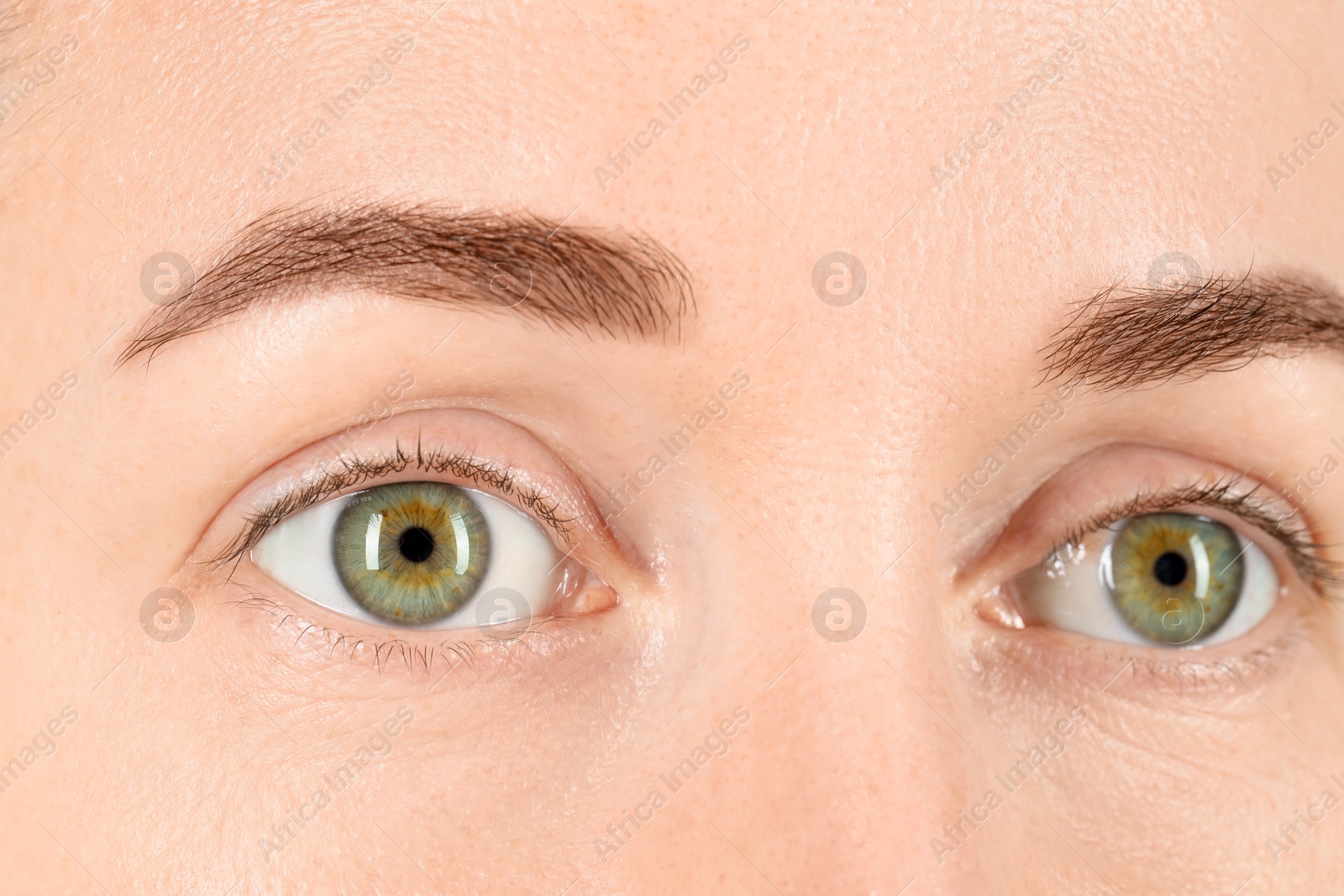 Photo of Woman with beautiful green eyes, closeup view