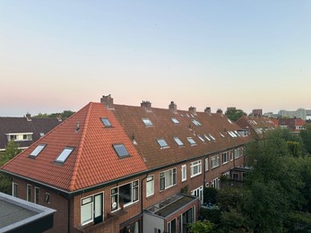 Beautiful view of city with buildings and trees under sky