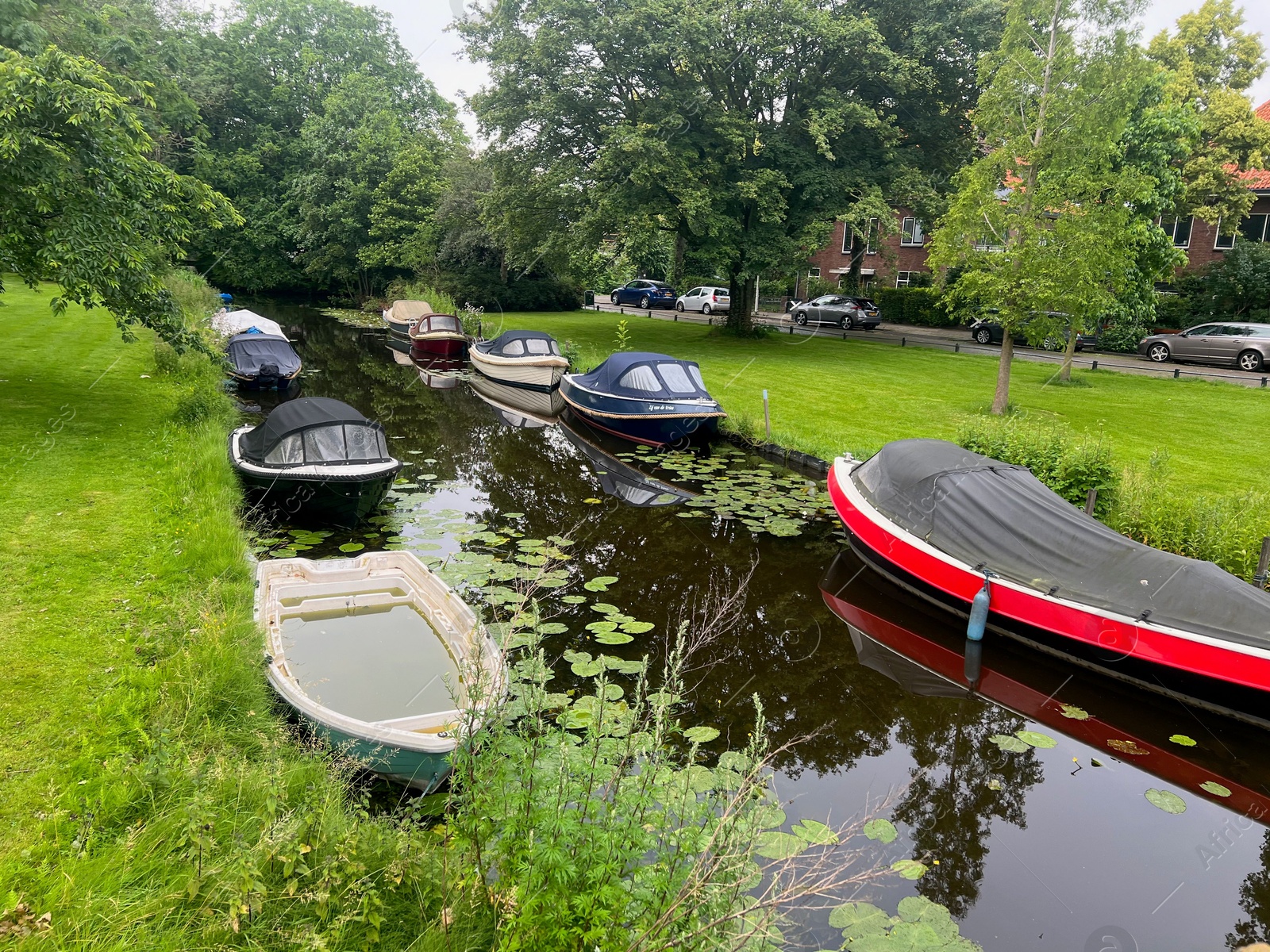 Photo of Picturesque view of canal with moored boats