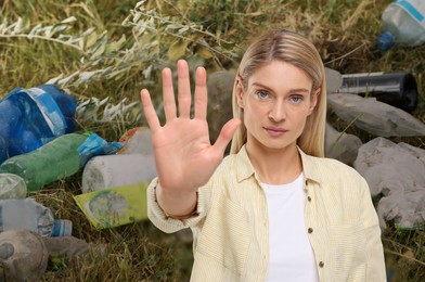 Image of Environmental pollution. Woman showing stop gesture among garbage on green grass
