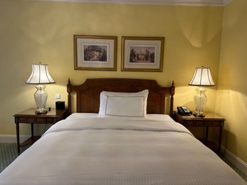 Photo of Berlin, Germany - July 1, 2024: Comfortable large bed with luxury bedding in Regent Berlin Hotel room