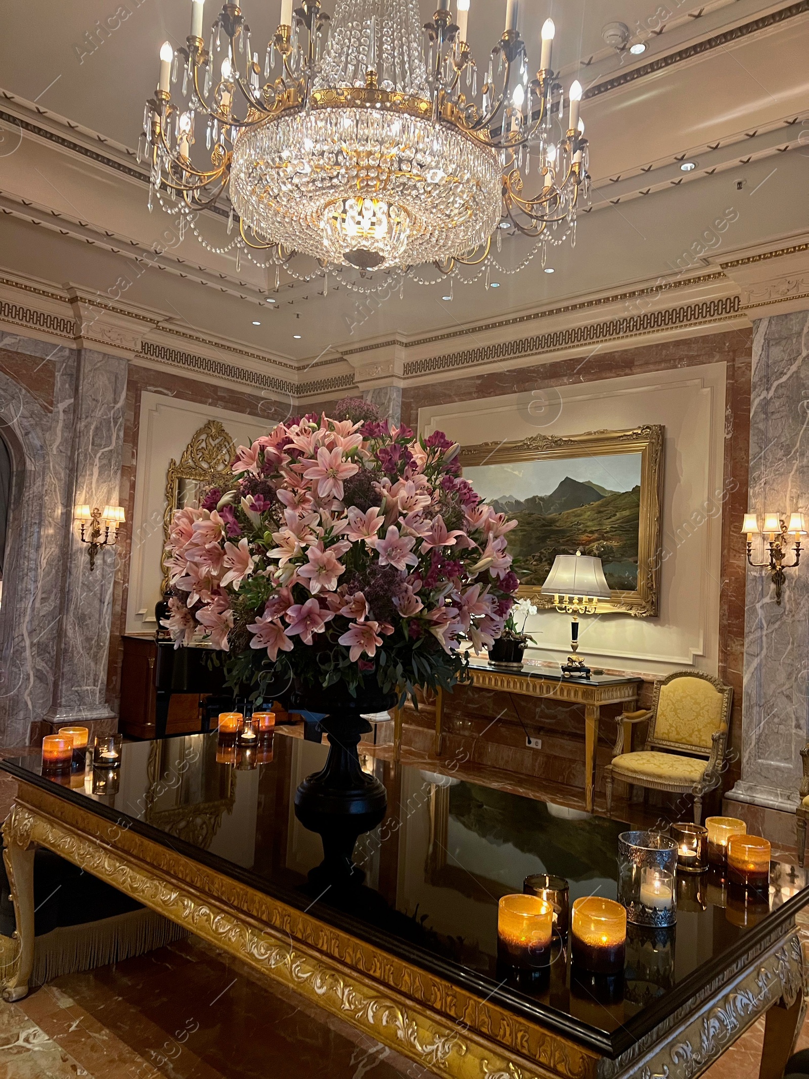 Photo of Berlin, Germany - July 1, 2024: Vase with beautiful flowers on mirrored table in Regent Berlin Hotel lobby