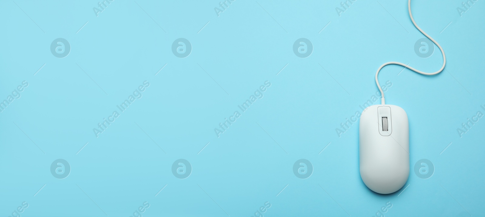 Image of Computer mouse on light blue background, top view. Banner design with space for text