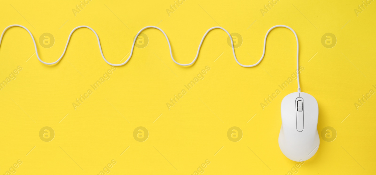 Image of Computer mouse on yellow background, top view. Banner design with space for text