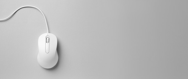 Image of Computer mouse on light grey background, top view. Banner design with space for text