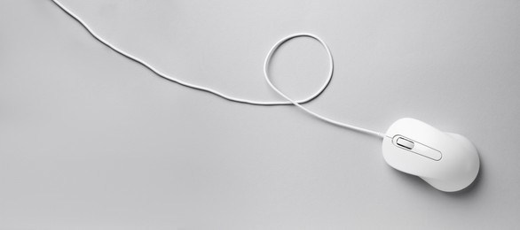 Image of Computer mouse on light grey background, top view. Banner design with space for text