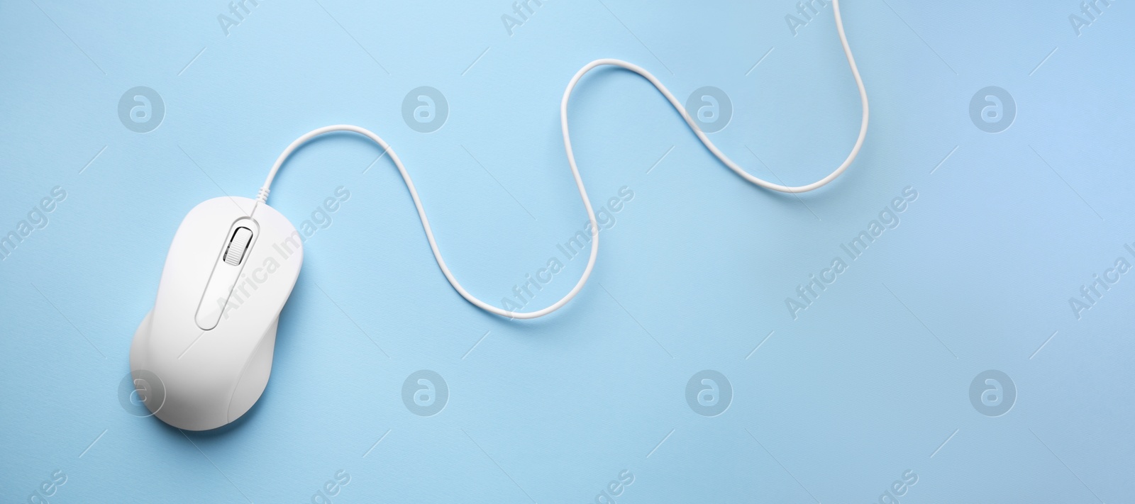 Image of Computer mouse on light blue background, top view. Banner design with space for text