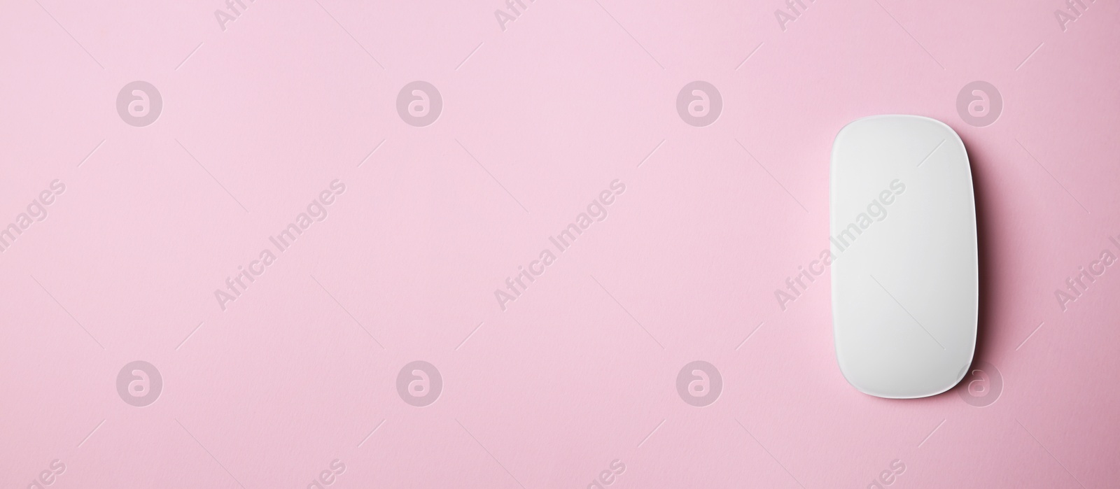 Image of Computer mouse on pink background, top view. Banner design with space for text