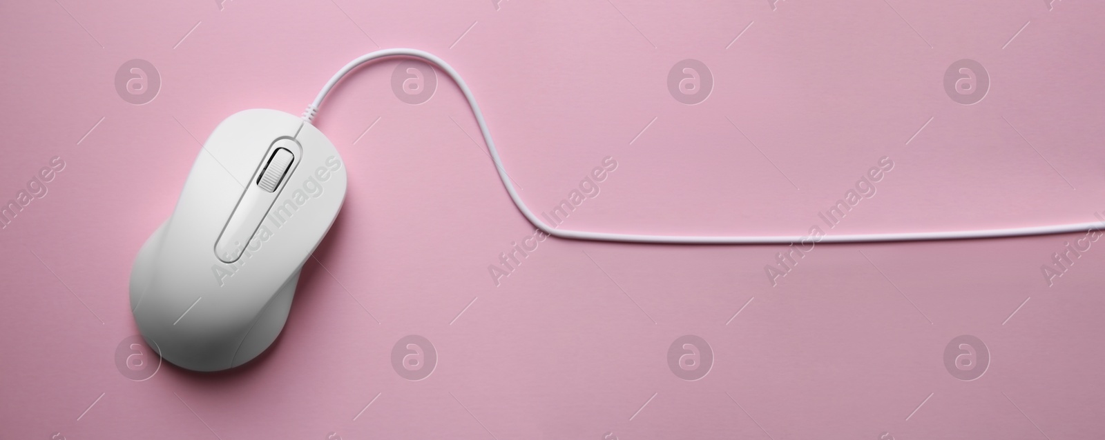 Image of Computer mouse on pink background, top view. Banner design with space for text