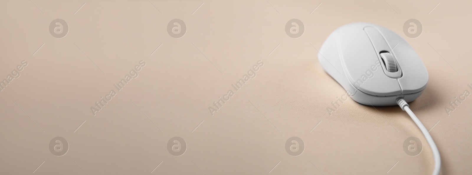 Image of Computer mouse on beige background. Banner design with space for text