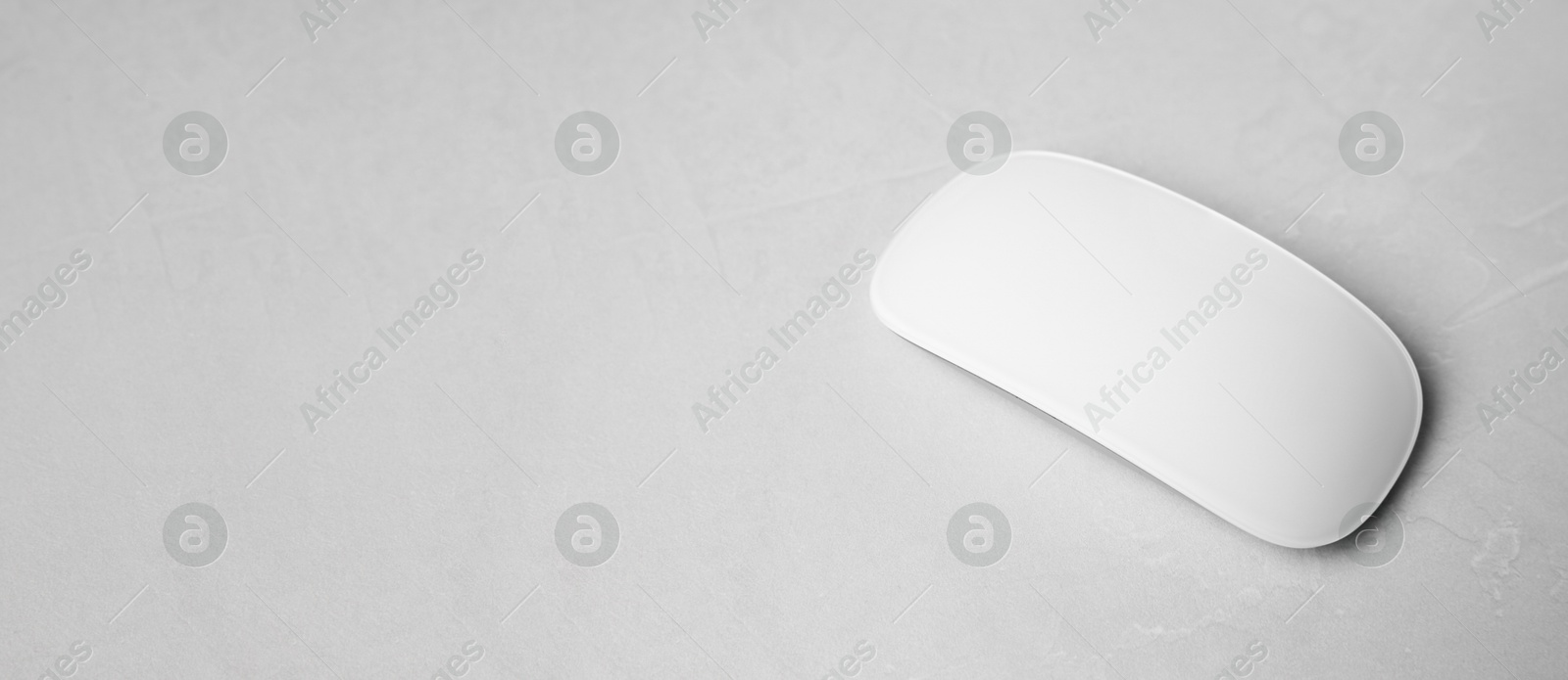 Image of Computer mouse on white table. Banner design with space for text