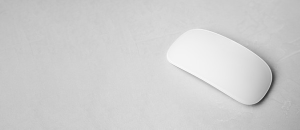 Image of Computer mouse on white table. Banner design with space for text