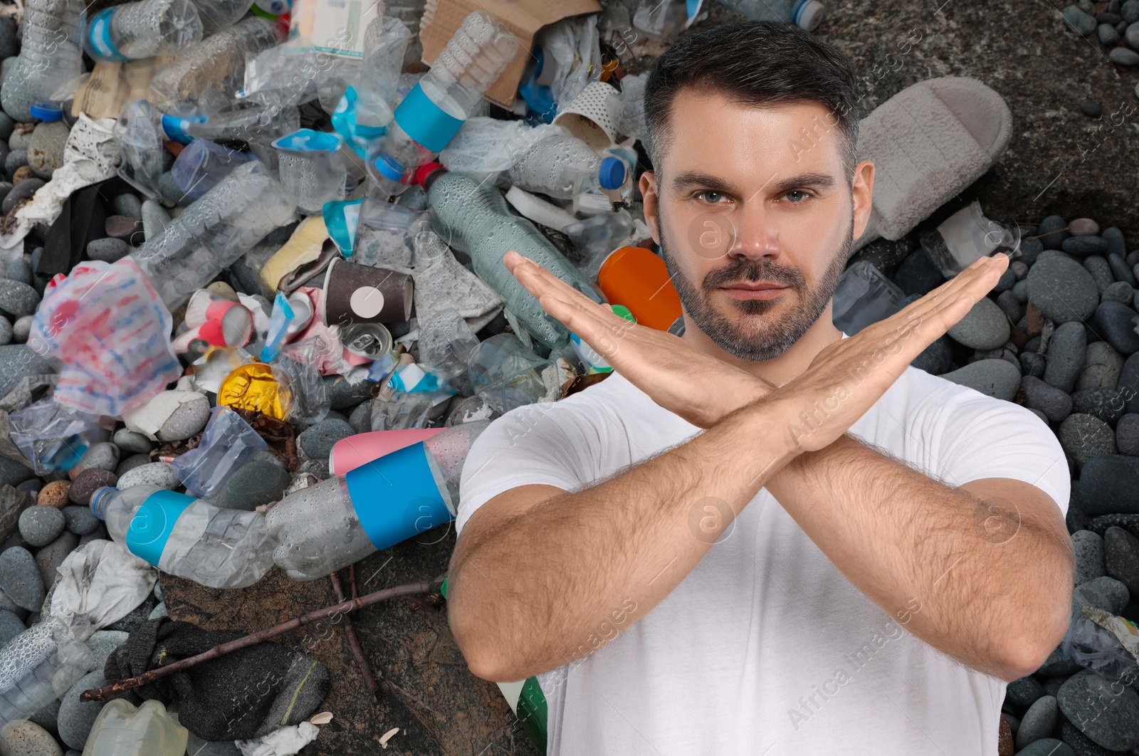 Image of Environmental pollution. Man showing stop gesture. Garbage on background