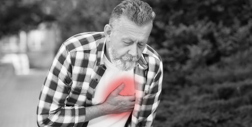 Image of Heart attack. Mature man suffering from pain in chest outdoors. Banner design