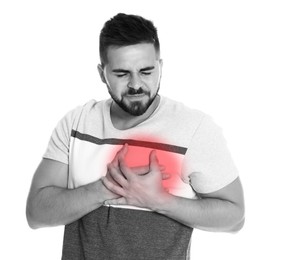 Image of Heart attack. Young man suffering from pain and pressing hands to chest on white background