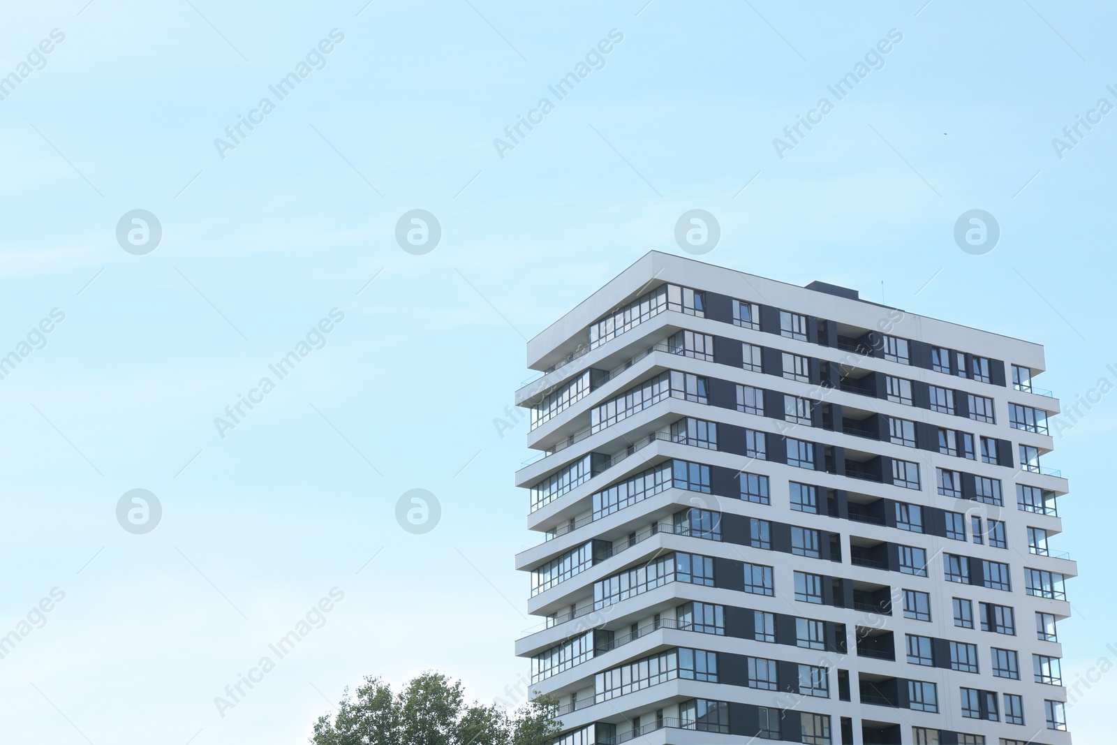 Photo of Modern building with big windows outdoors, space for text