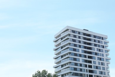 Photo of Modern building with big windows outdoors, space for text