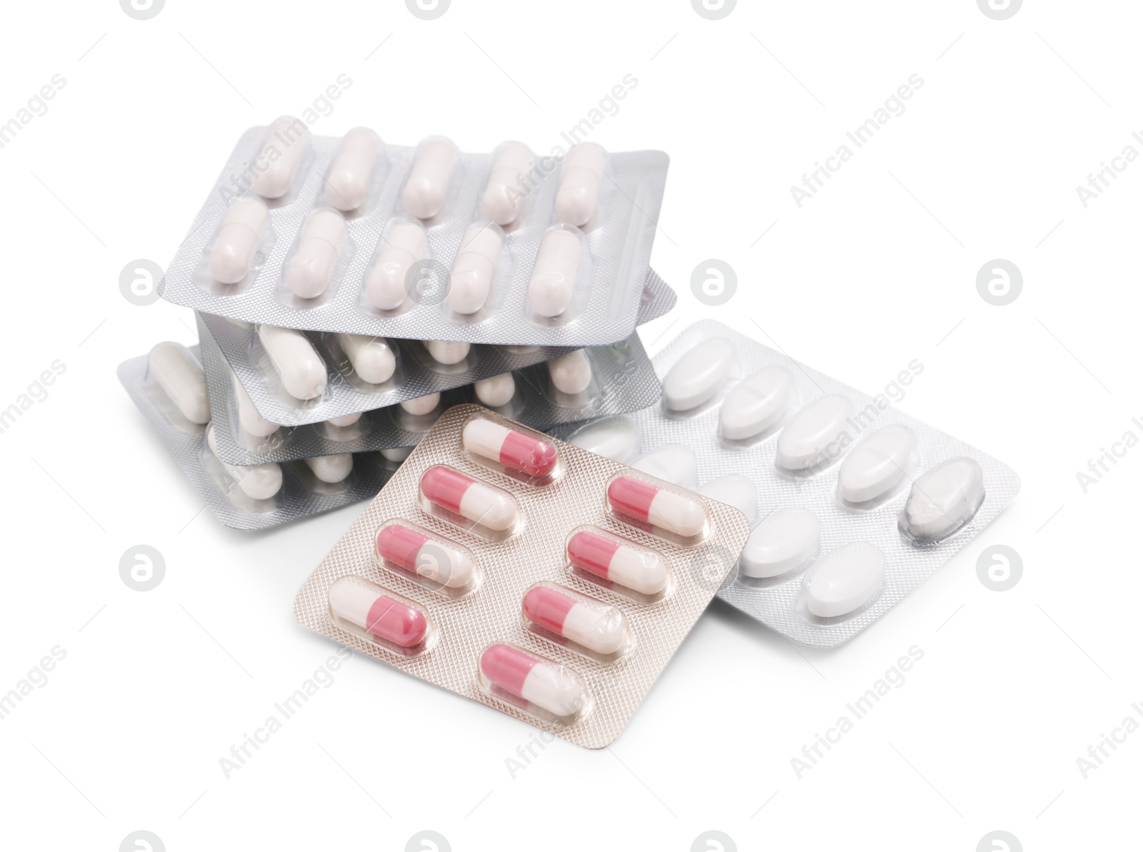 Photo of Different antibiotic pills in blisters isolated on white