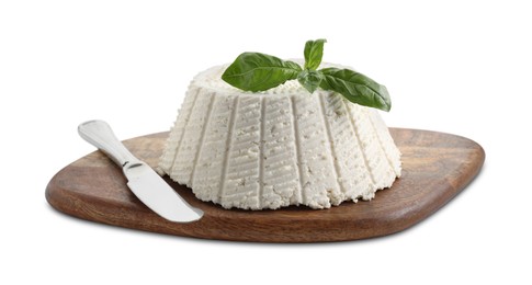 Photo of Tasty ricotta (cream cheese), basil and knife isolated on white