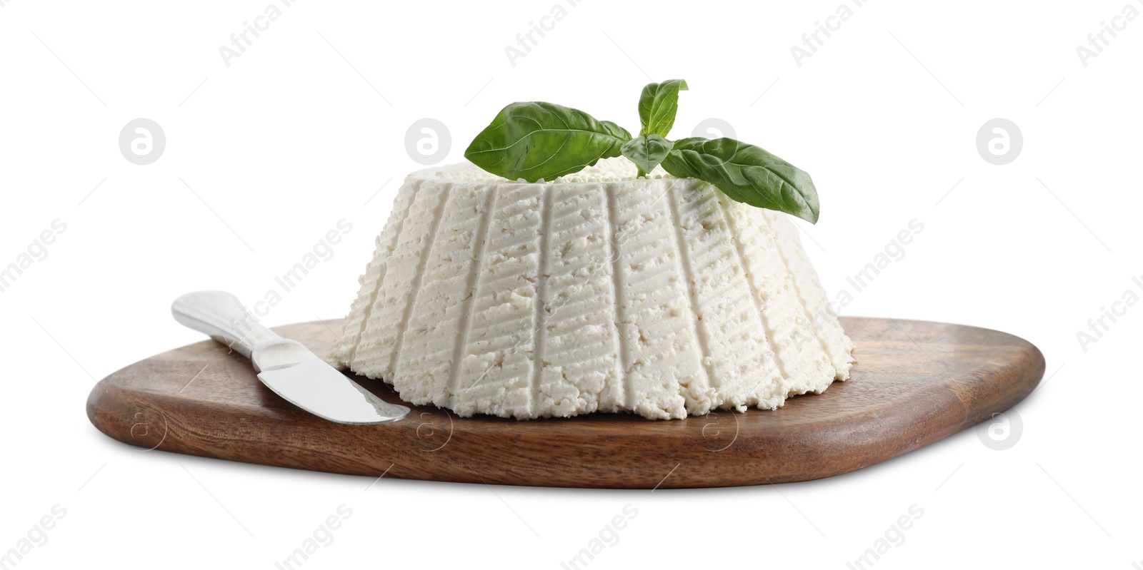 Photo of Tasty ricotta (cream cheese), basil and knife isolated on white