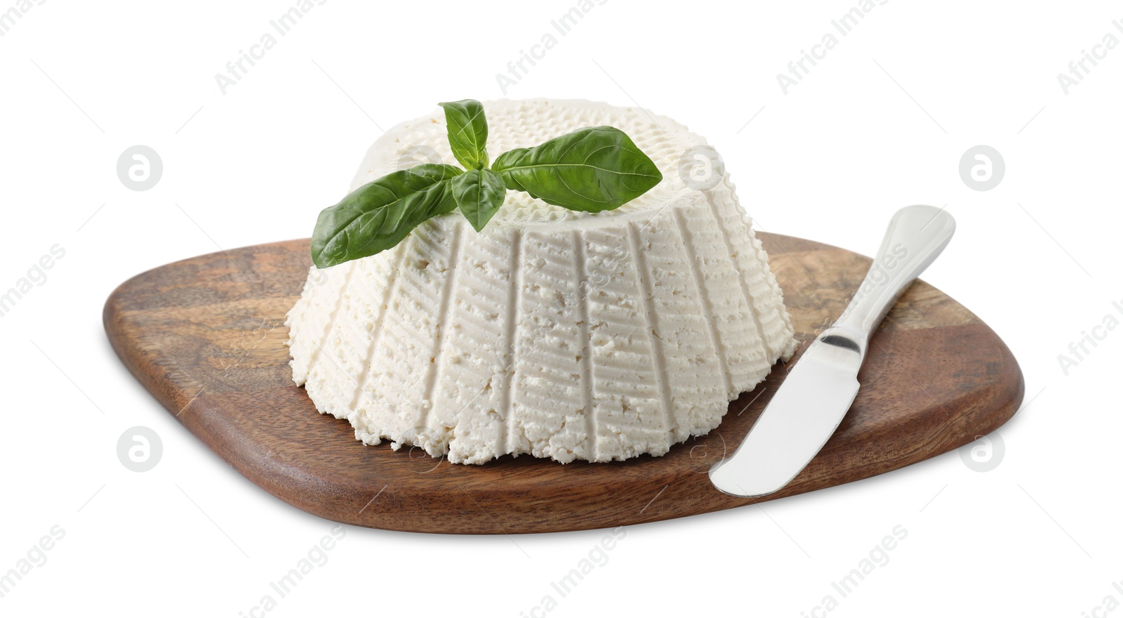 Photo of Tasty ricotta (cream cheese), basil and knife isolated on white