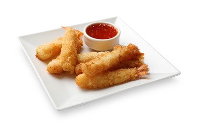 Photo of Tasty breaded fried shrimps and sauce isolated on white