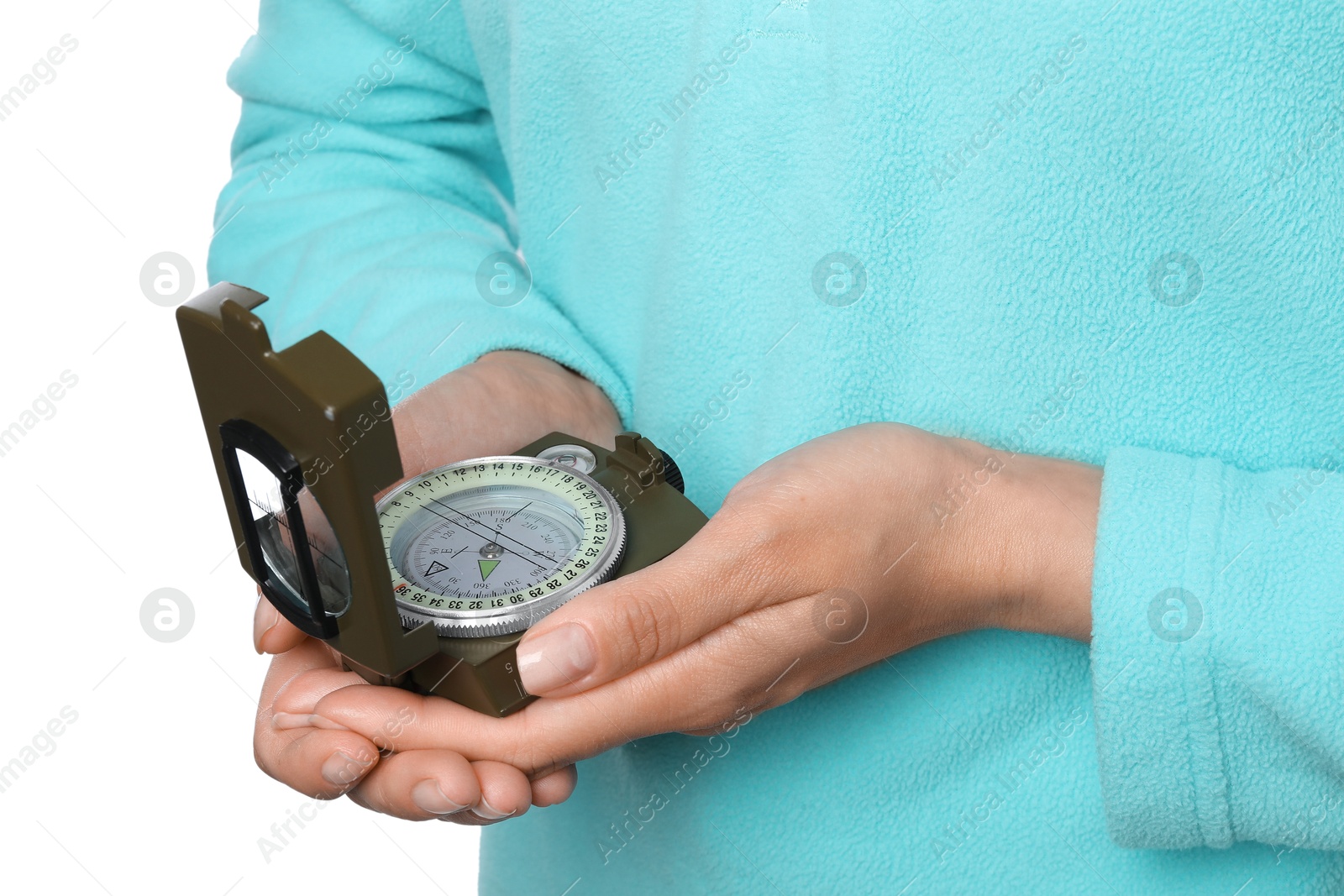 Photo of Woman holding compass on white background, closeup