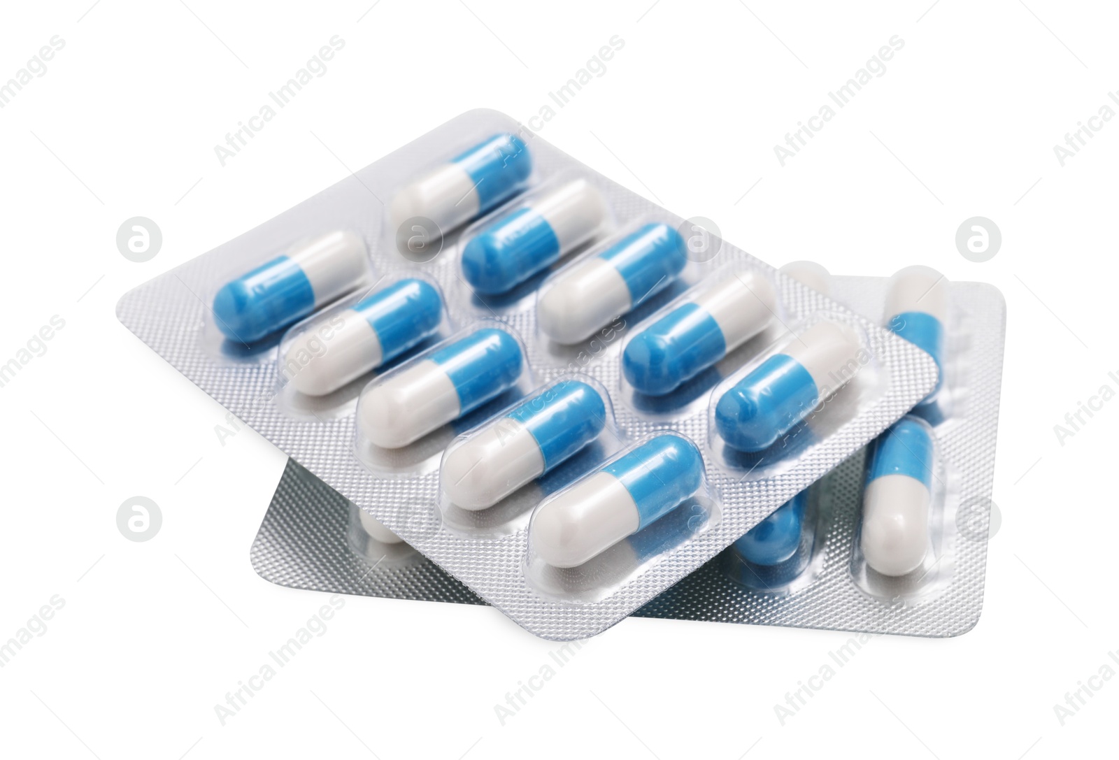 Photo of Antibiotic pills in blisters isolated on white