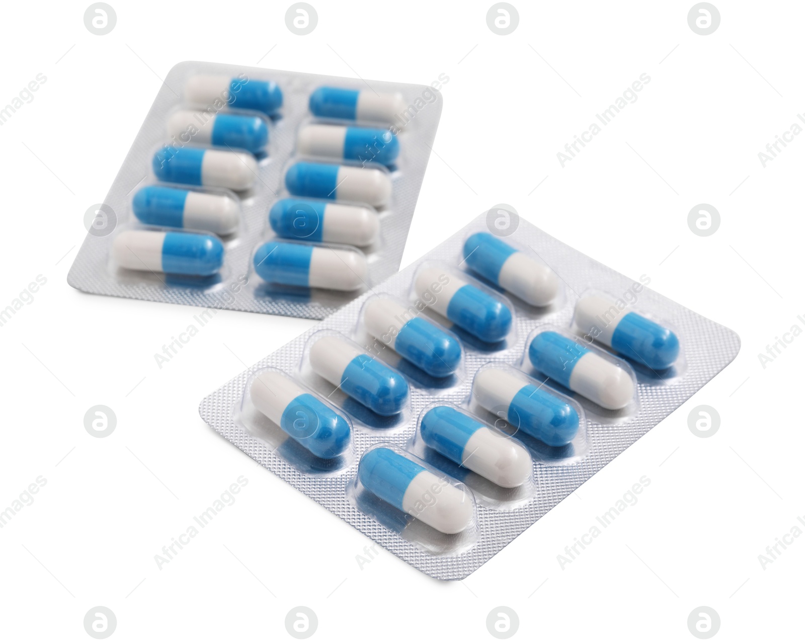 Photo of Antibiotic pills in blisters isolated on white