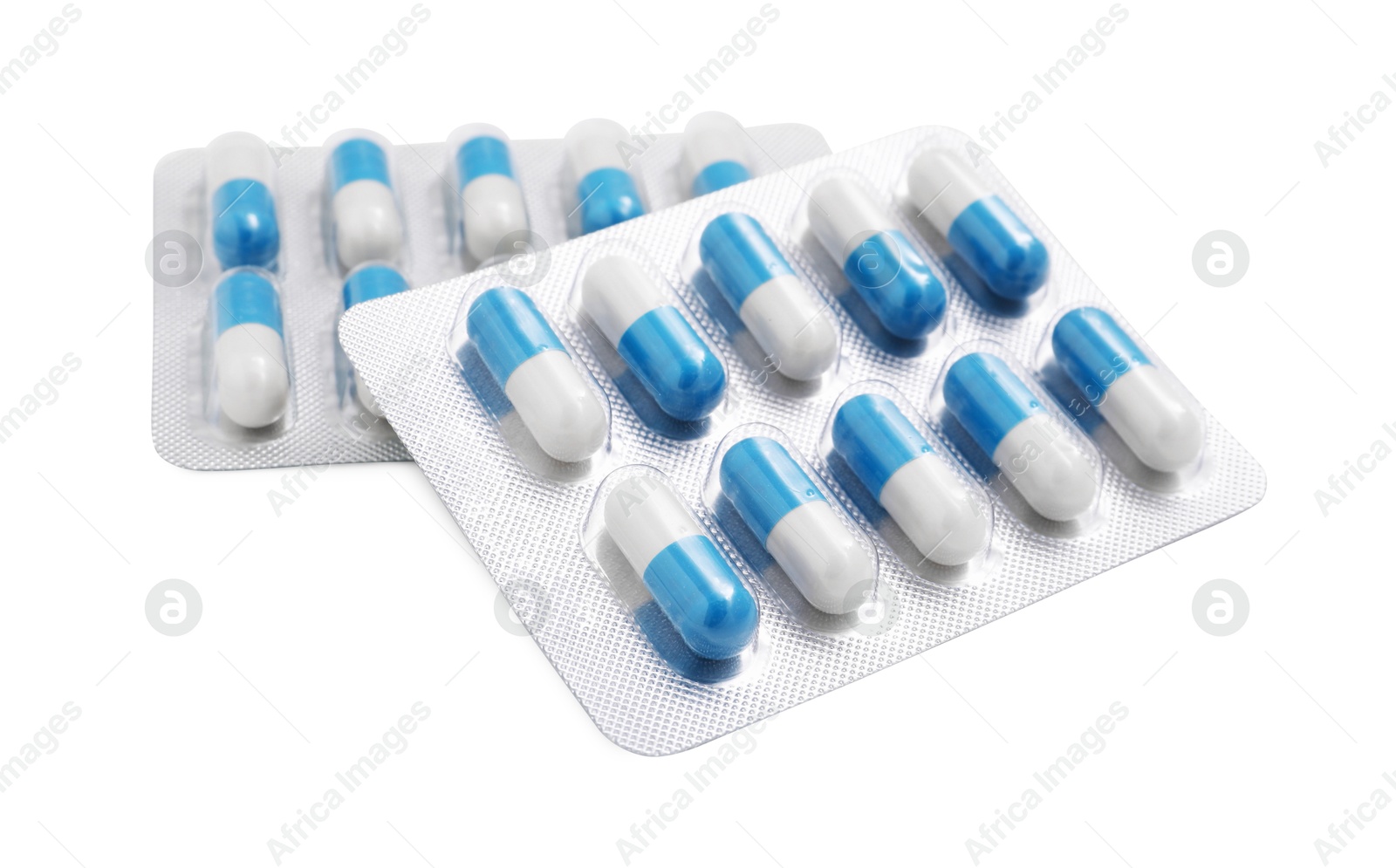 Photo of Antibiotic pills in blisters isolated on white