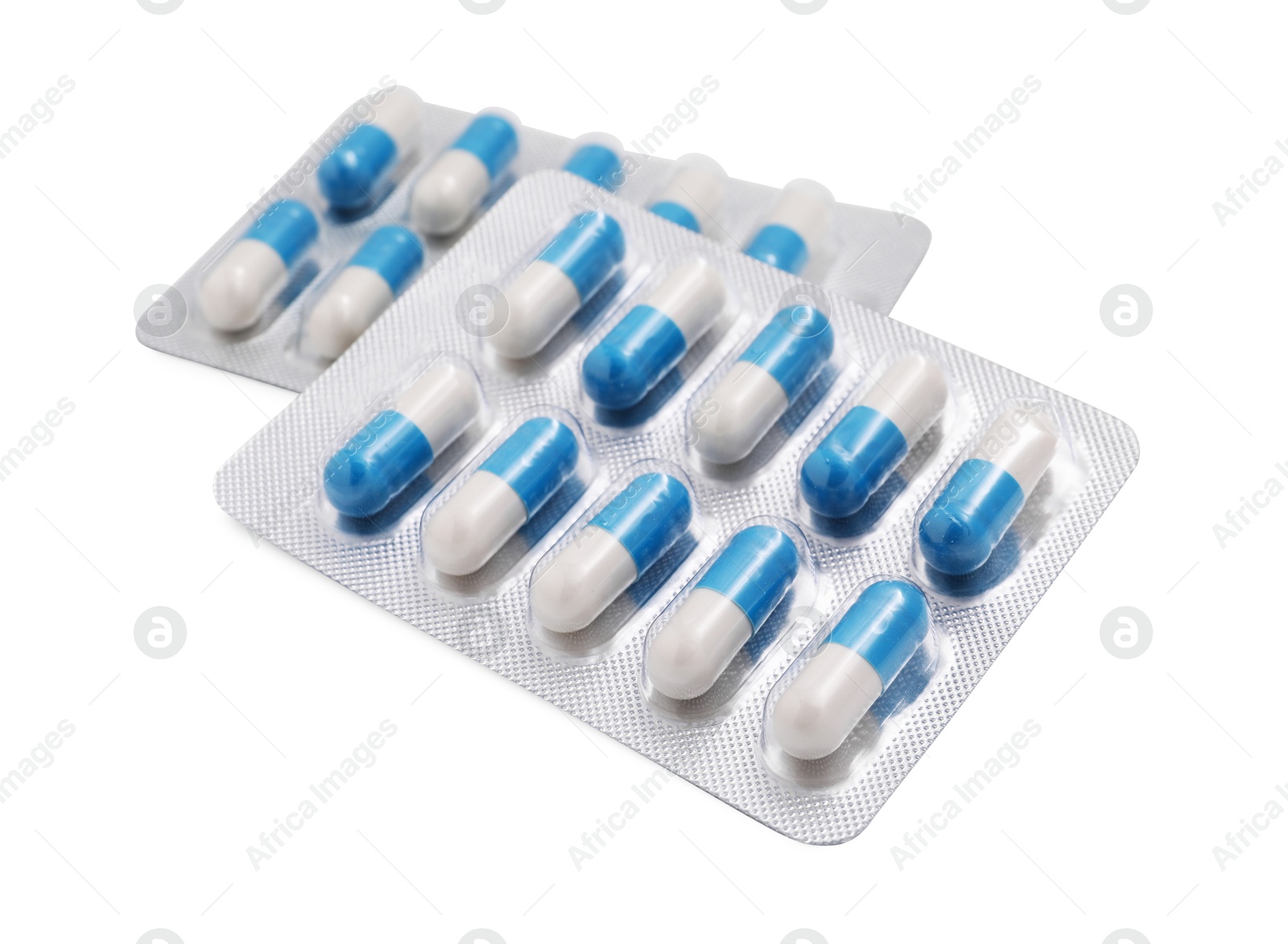 Photo of Antibiotic pills in blisters isolated on white