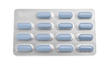 Photo of Antibiotic pills in blister isolated on white, top view